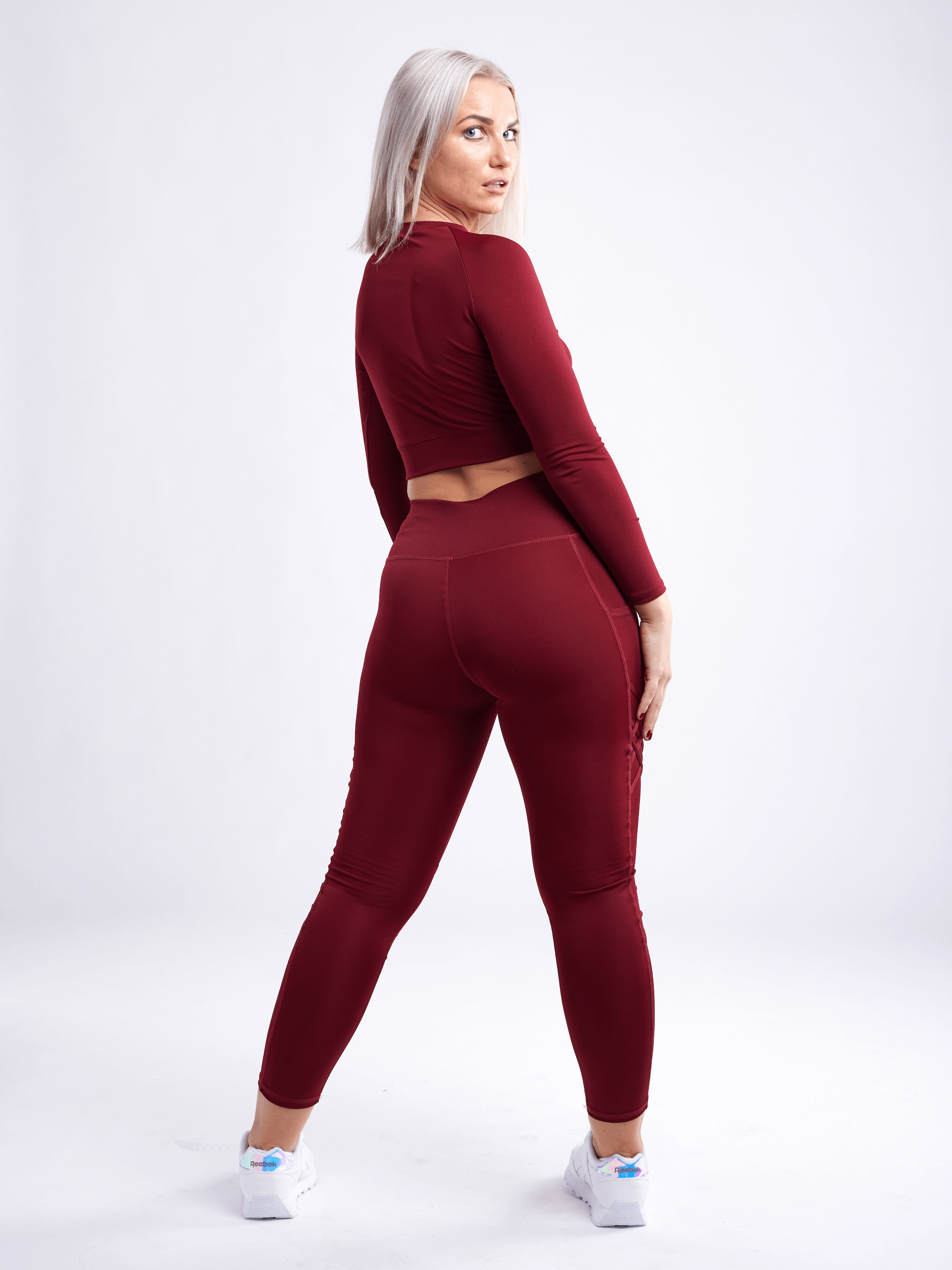 Black Lavender JupiterGear long-sleeve crop top, activewear for women, shown in black with fitted design and thumbholes.
