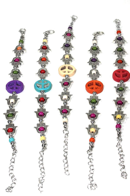 Silver Hestia Hamsa Hands and Peace bracelet with intricate charms, designed for stylish protection and peaceful vibes.