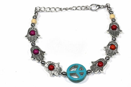 Silver Hestia Hamsa Hands and Peace bracelet featuring intricate charm designs on a silver bracelet for protection and harmony.