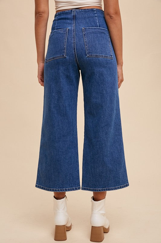 Jade Icarus Annie Wear button fly high waist jeans, automotive-themed design, displayed on a hanger against a neutral background.
