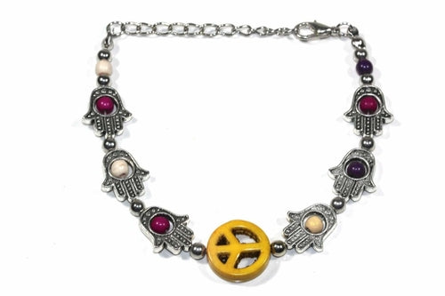 Silver Hestia Hamsa hands and peace bracelet with intricate design, featuring symbolic charms on a delicate silver band.