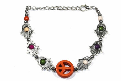 Silver Hestia Hamsa Hands and Peace bracelet featuring a charm and beaded design on a delicate silver bracelet.