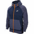 Dark blue Nike Sportswear sports jacket with lightweight design and zippered pockets, ideal for outdoor activities.