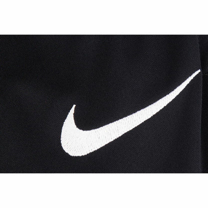 Black Nike I FIT PARK adult sports trousers with Nike logo, designed for active wear and outdoor activities.