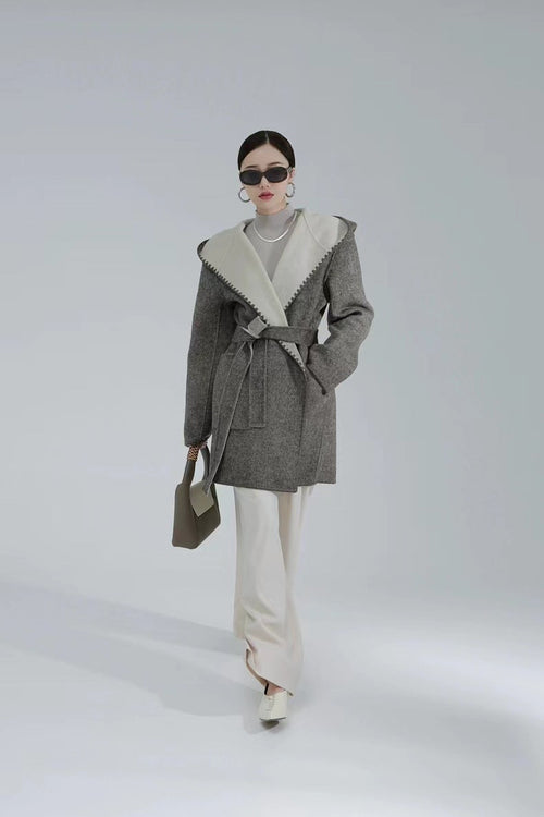 Women’s reversible cashmere coat by Carmine Juneberry, showcasing luxurious, versatile design in a stylish jacket.