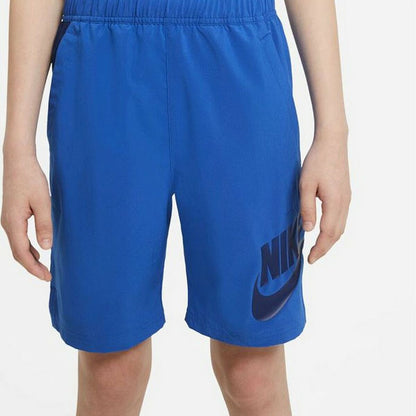Kids Nike Sportswear sport shorts in blue with white Nike logo, designed for active outdoor play.