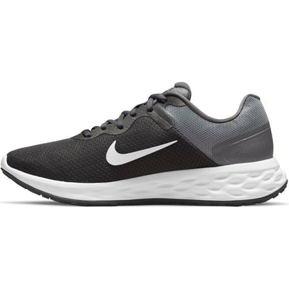 Pair of grey Nike Revolution 6 running shoes for adults, featuring breathable mesh and cushioned soles for sports and outdoor activities.