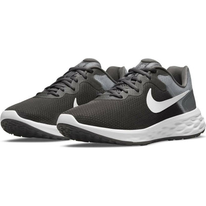 Nike Revolution 6 grey running shoes for adults, featuring lightweight design and breathable mesh for sports and outdoor activities.