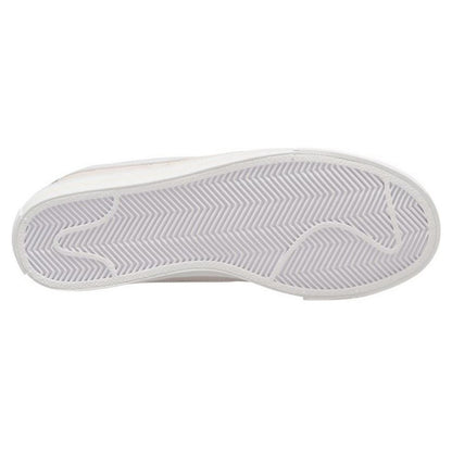 Nike Court Legacy W trainers in white and black, with classic design and Nike branding, shown on a plain background.