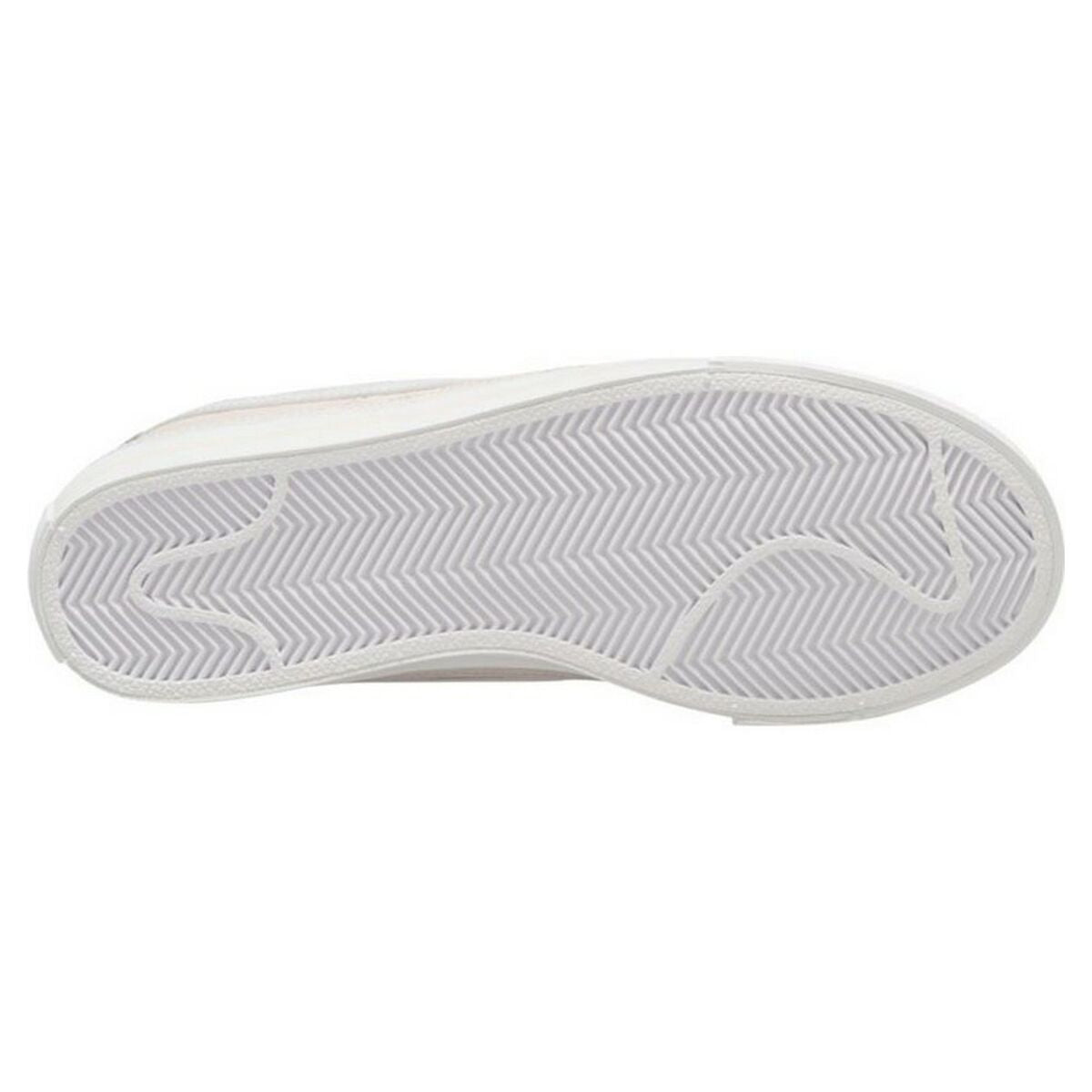 Nike Court Legacy W trainers in white and beige with rubber soles, displayed on a neutral background.