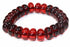 Silver Hestia glowing amber red bracelet featuring a string of luminous amber-red beads on a silver bracelet.
