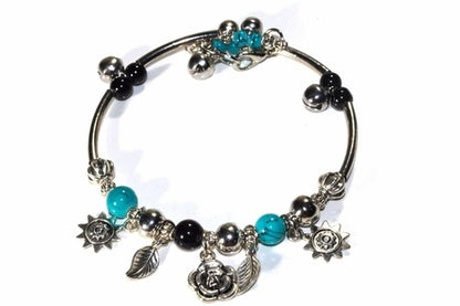 Silver Hestia Spring Love Charm Bracelet featuring delicate floral and heart charms on a silver bracelet.