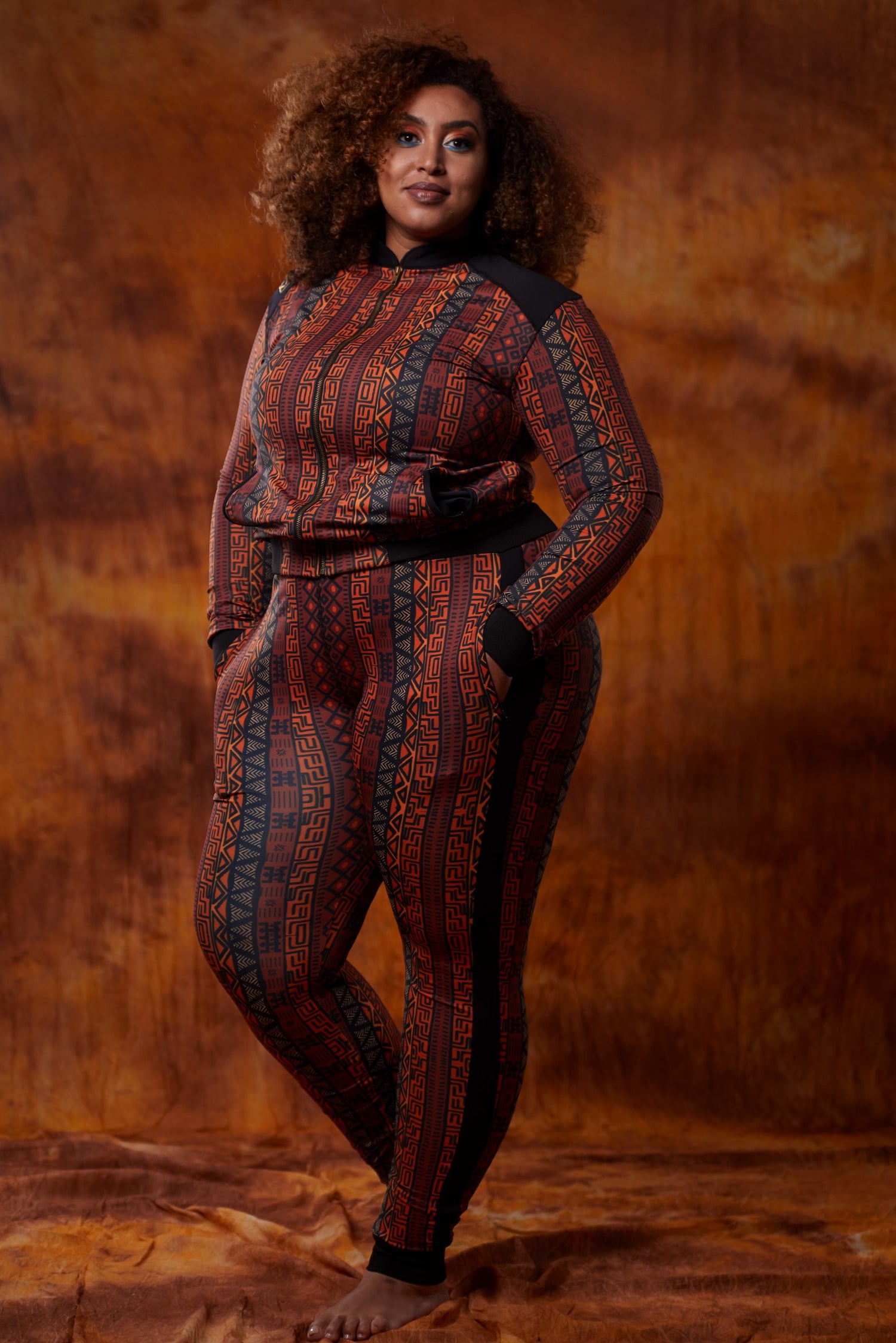 Women’s African tracksuit by Olive Buckeye, featuring vibrant patterns and comfortable fit, shown on a model.