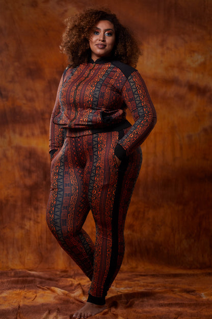 Women’s African tracksuit by Olive Buckeye, featuring vibrant patterns and comfortable fit, shown on a model.