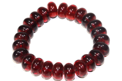 Amber red bracelet from Silver Hestia with glowing wine-colored beads and silver accents, stylish jewelry accessory.