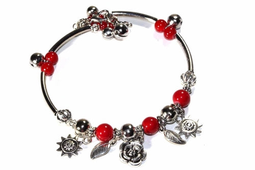 Silver Hestia Spring Love Charm Bracelet featuring delicate spring-themed charms on a silver bracelet.