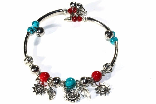 Silver Hestia Spring Love Charm Bracelet with delicate floral and heart charms on a silver chain.