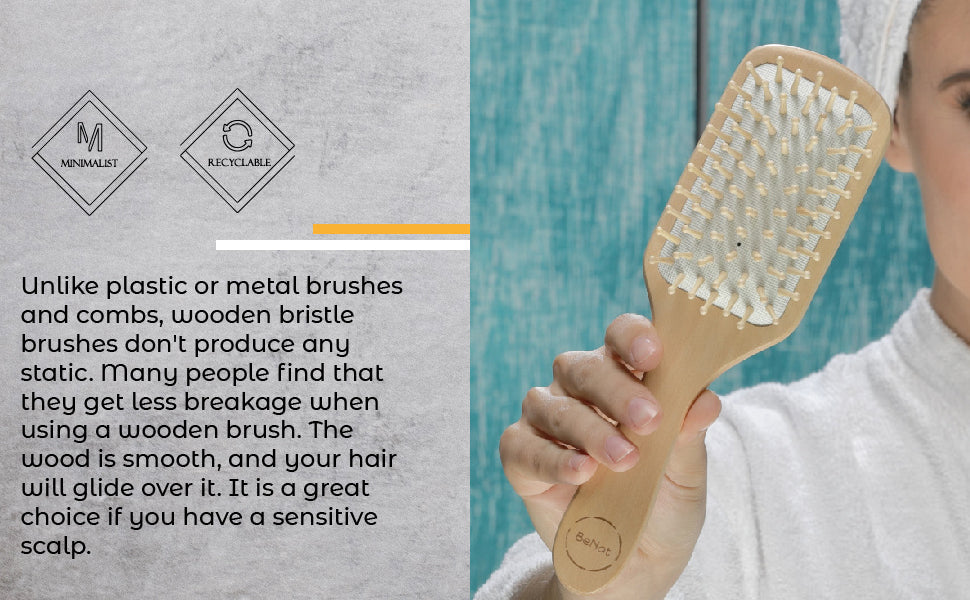 Natural wooden detangling hair brush from Jade Chrysippus, suitable for bathroom use, with smooth wooden bristles for gentle detangling.