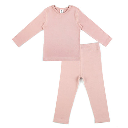 Organic cotton baby toddler pajama set by Amber Erebus with flat seams, designed for comfort and high-tension support.