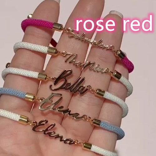 Colorful personalized rope chain bracelet with custom name, pink lucky brand, designed for women, close-up view of vibrant jewelry.