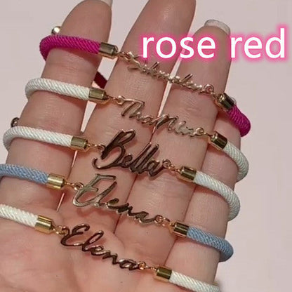 Colorful personalized rope chain bracelet with custom name, pink lucky brand, designed for women, close-up view of vibrant jewelry.