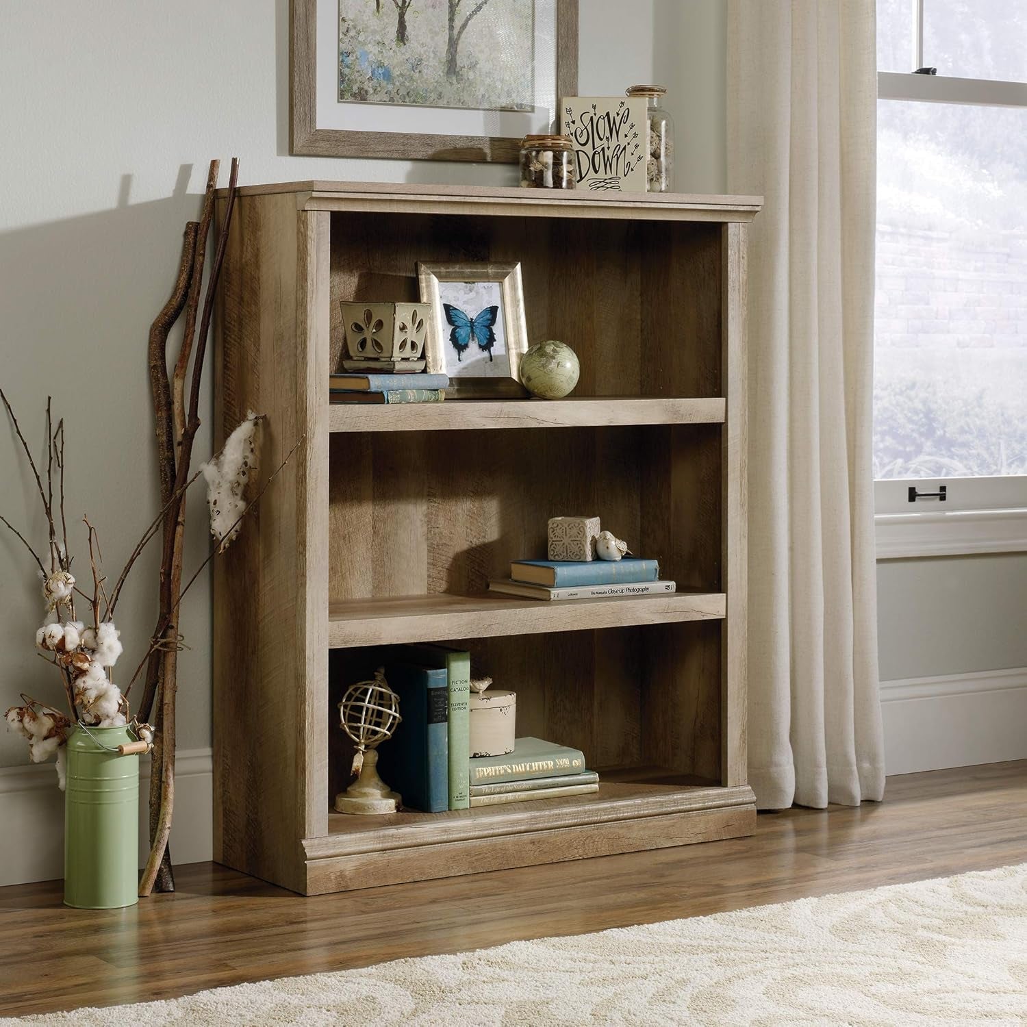 Peach Maple three-shelf bookcase in lintel oak finish, ideal for living room storage and display.