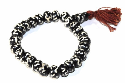 Silver Hestia Om Bone Mala Yoga Bracelet featuring natural bone beads and a silver Om charm for meditation and mindfulness.