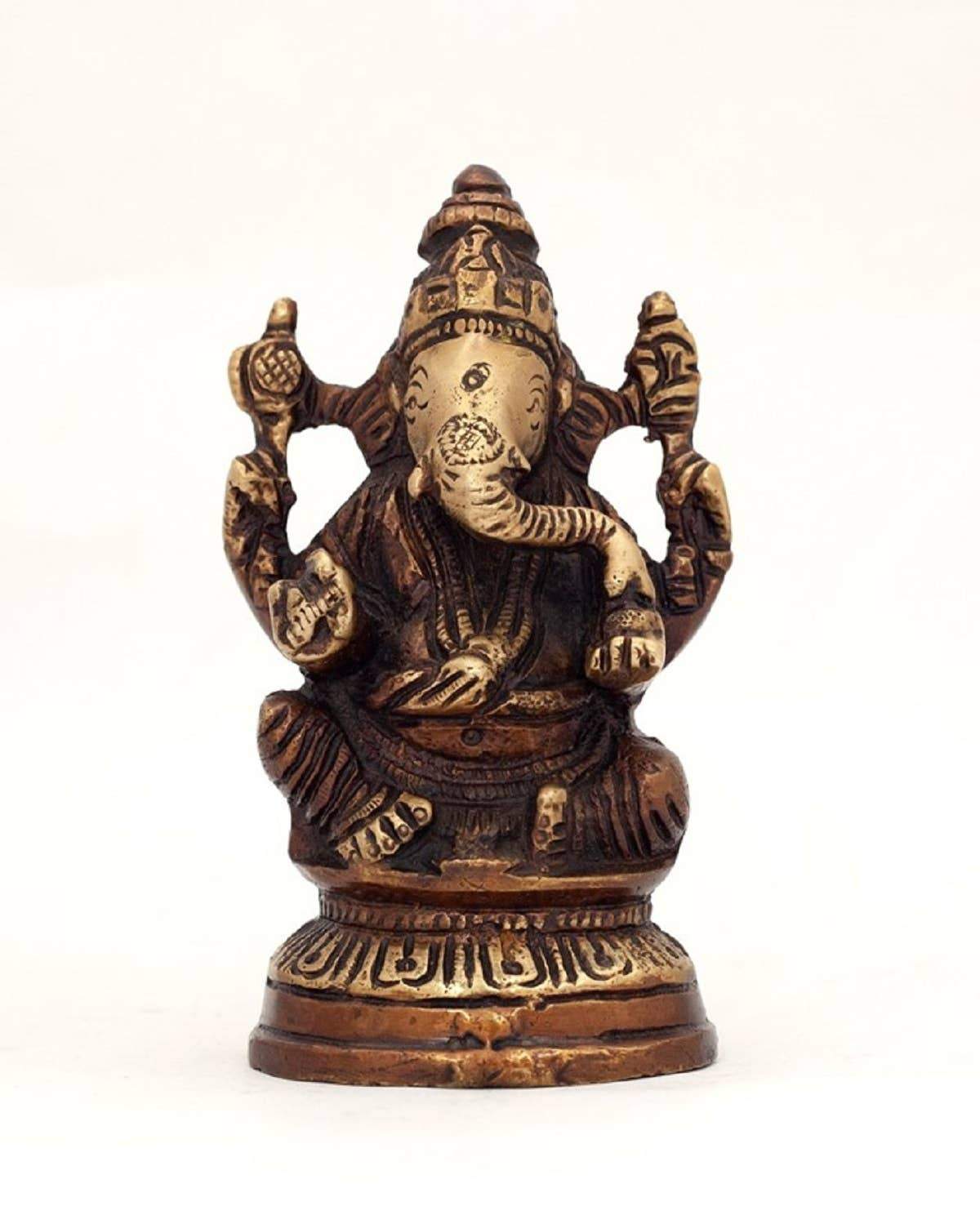 Alabaster Ganesha statue sitting on a lotus flower, 5-inch sacred home decor for spiritual space or garden.