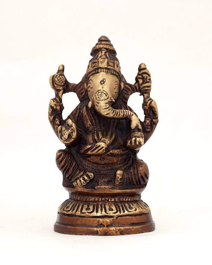 Alabaster Ganesha statue sitting on a lotus flower, 5-inch sacred home decor for spiritual space or garden.