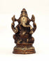 Alabaster Ganesha statue sitting on lotus flower, 5-inch sacred home decor sculpture for spiritual space and meditation.