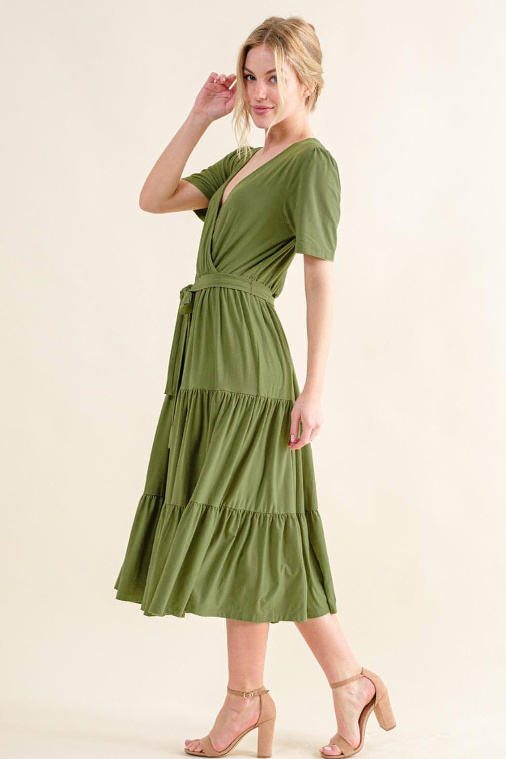 Carmine Juneberry And The Why soft short sleeve tiered midi dress hanging on a rack, lightweight fabric, casual summer style.