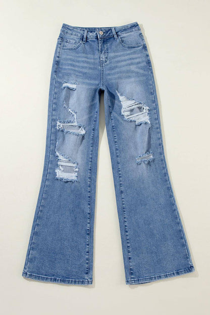 Ashleigh Blue Acid Wash Distressed Wide Leg High Waist Jeans by Carmine Juneberry, showing distressed details and high waist fit.