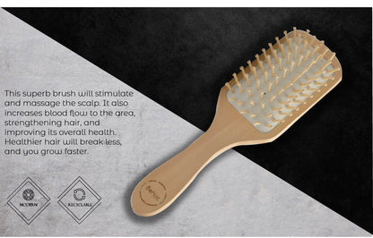 Natural wooden detangling hair brush by Jade Chrysippus with ergonomic handle, designed for gentle hair detangling in the bathroom.