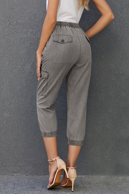 Women’s gray drawstring cargo joggers with multiple pockets, made by Lavender Pallas, casual and comfortable women&