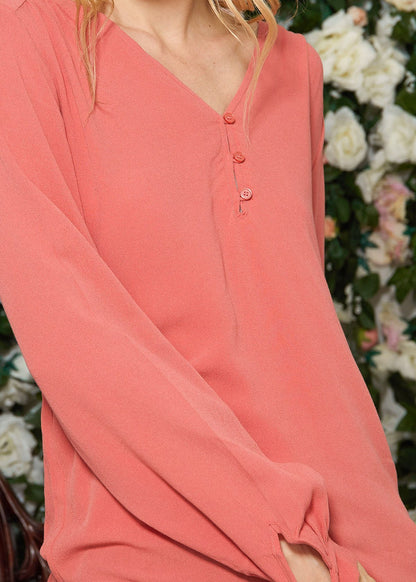 V-neck tie cuff blouse in faded coral by Lemon Hera, featuring a relaxed fit and delicate fabric detail.