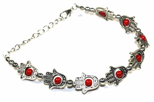 Silver Hestia Hamsa hands and vibrant bead bracelet with colorful beads and intricate silver details.