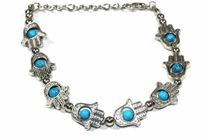 Silver Hestia Hamsa hands and vibrant bead bracelet featuring colorful beads and intricate silver Hamsa charms.