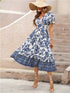 Women’s short sleeve V-neck floral maxi dress by Jade Icarus, featuring a vibrant floral pattern and flowing fabric.