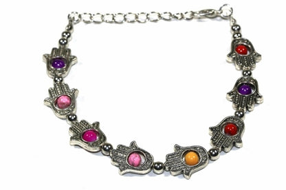 Silver Hestia Hamsa Hands and vibrant bead bracelet featuring colorful beads and intricate silver charms.