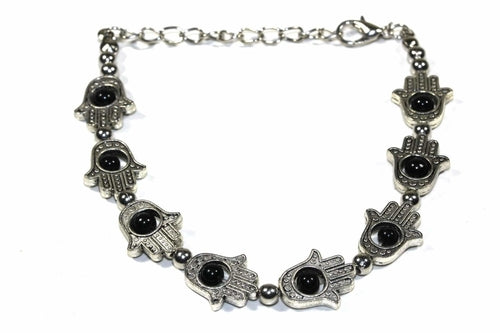Silver Hestia Hamsa Hands and vibrant bead bracelet with colorful stones, showcasing intricate design and detailed craftsmanship.
