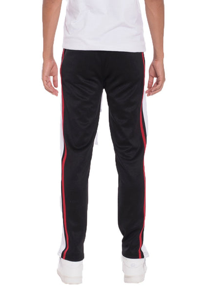 Black striped tricot track pants by Lime Milo, casual pants with a comfortable fit and stylish striped design.