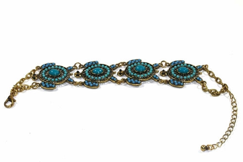 Colorful bead drop turtle bracelet by Silver Hestia featuring vibrant beads and a turtle charm, laid flat against a white background.