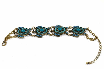 Colorful bead drop turtle bracelet by Silver Hestia featuring vibrant beads and a turtle charm, laid flat against a white background.