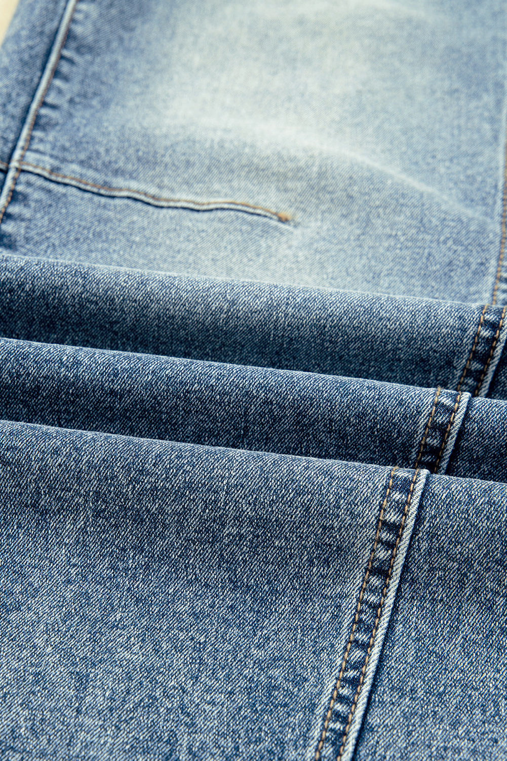 Vintage washed seam shift jeans for women by Byzantium Bay, showing distressed denim with seam details and relaxed fit.