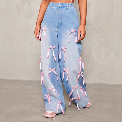 Carmine Juneberry Bow High Waist Wide Leg Jeans in Haute Edition, featuring a high waist, wide legs, and bow detail in denim.