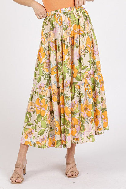 Colorful flower print elastic waist tiered skirt by Jade Icarus, featuring a flowing fabric design.