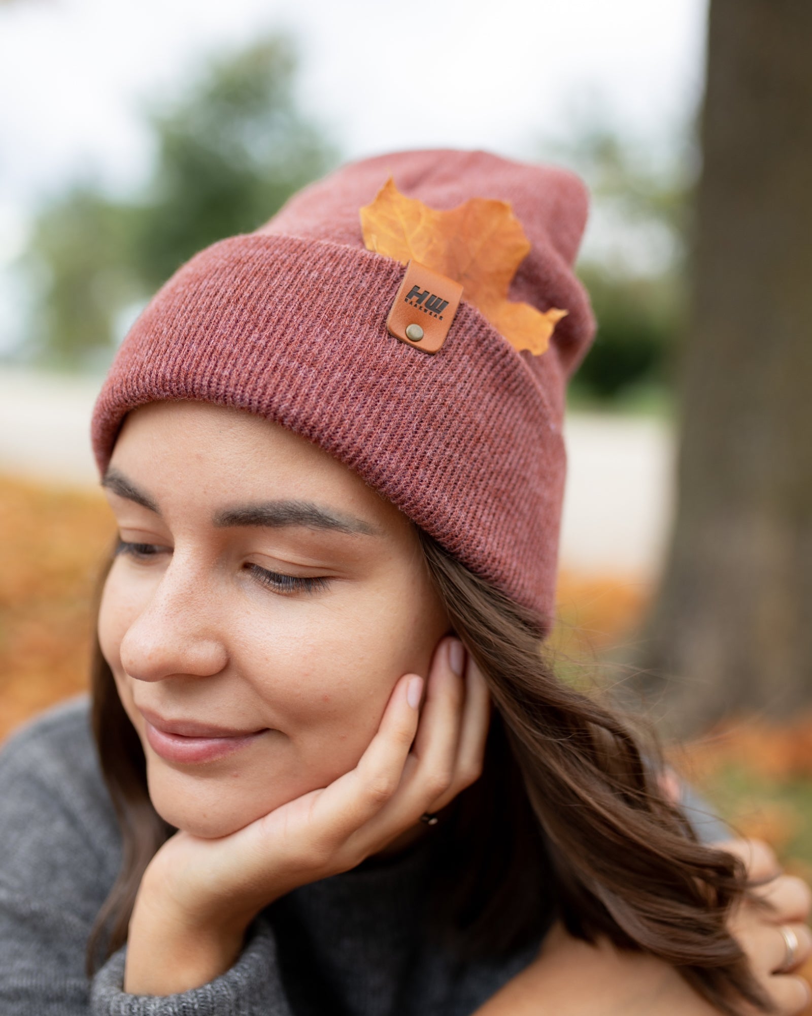 Azure Arrowwood HAAKWEAR knit cuffed beanie in rusty burgundy, soft and warm hat with a cozy knit texture.