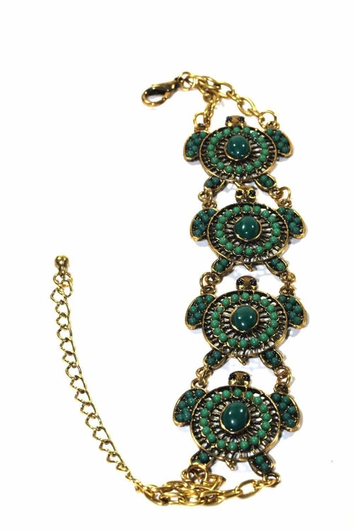 Colorful bead drop turtle bracelet by Silver Hestia featuring vibrant beads and a turtle charm, styled as a bracelet.