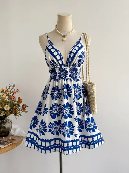 Floral print V-neck mini dress from Pear Daisy featuring a colorful floral pattern and a stylish V-neck design.