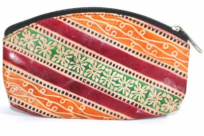 Silver Hestia Groovy coin purse with colorful patterns, compact design, and zipper closure, perfect for storing small essentials.